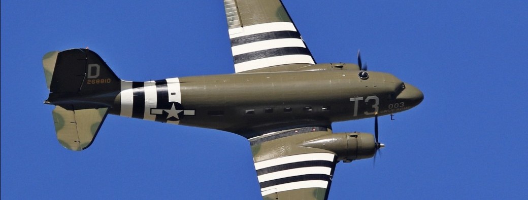 Fly in a Dakota over the D-Day beaches